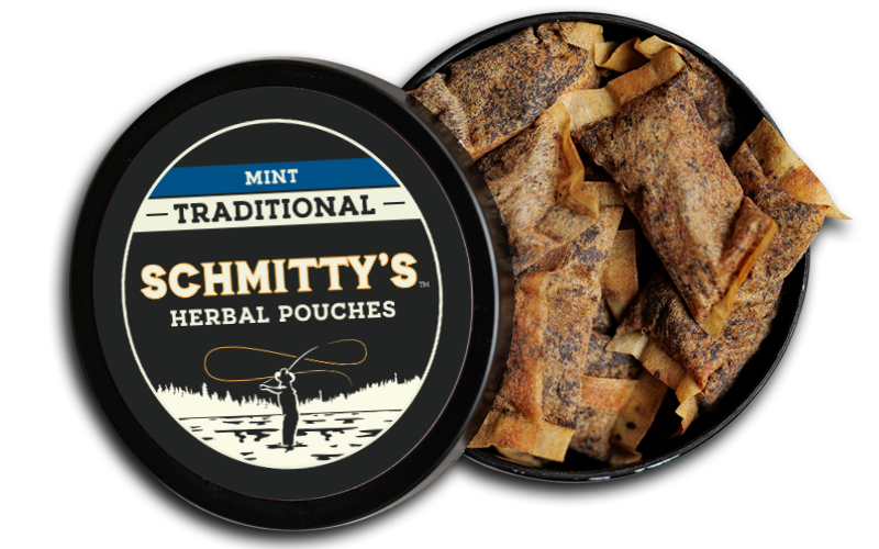 A container of mint pouches labeled 'Schmitty’s Herbal Pouches' with a view of the product inside, showing pouches with a mint herb mixture.